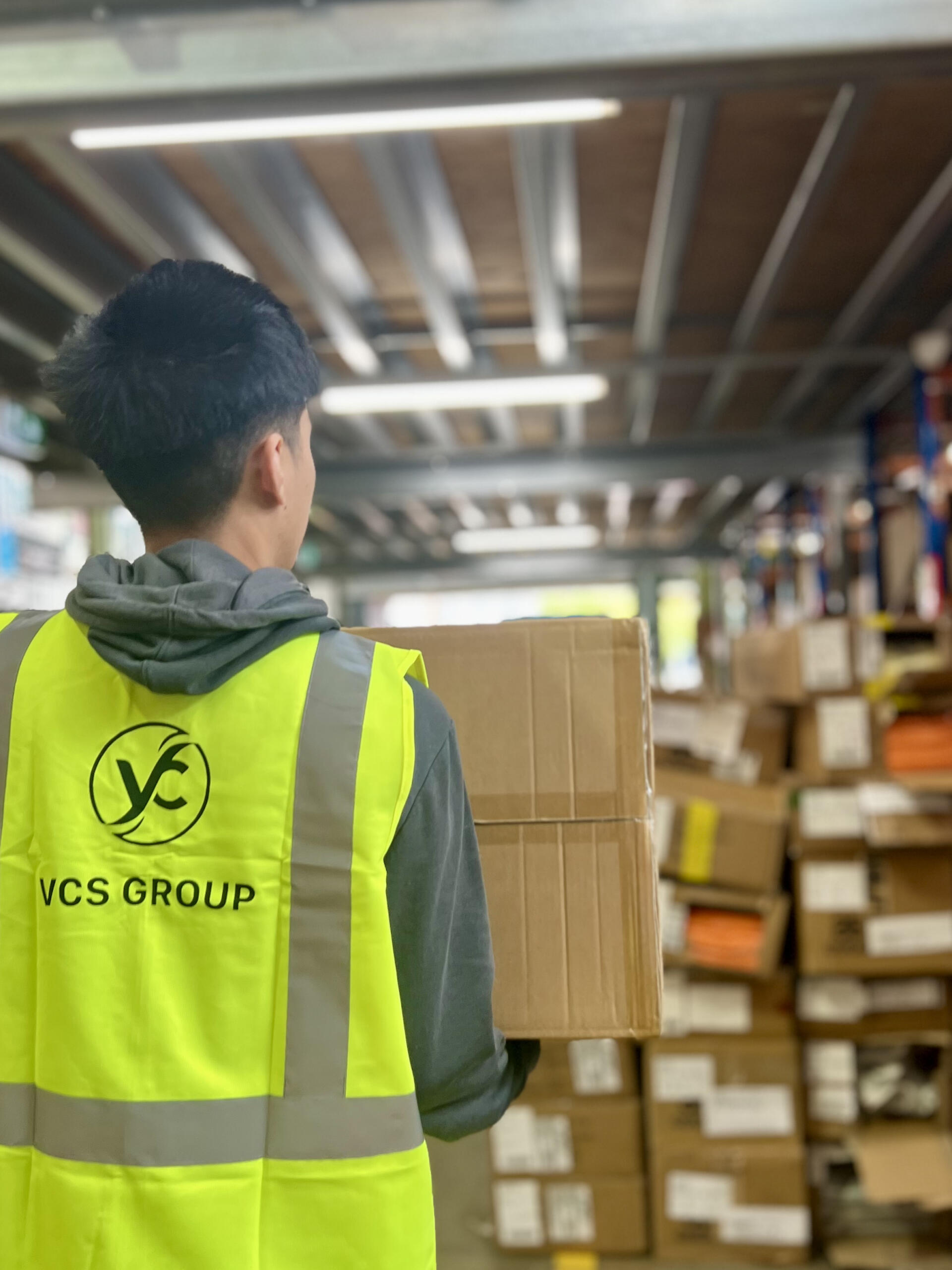 Warehouse worker carrying a box
